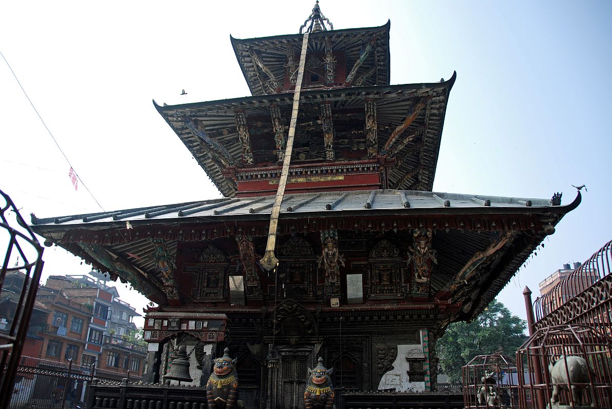 Kathmandu Patan 02-3 Rato Red Machhendranath Temple North Doorway Guarded By Two Snow Lions With Animals On Top Of Pillars 